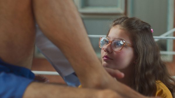 The Days With Her film image; man sitting above a young girl