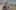 The Dreamed Adventure film image; woman walking down a path from an ancient-looking building