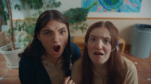 Edie Arnold is a Loser film image; two people screaming at something