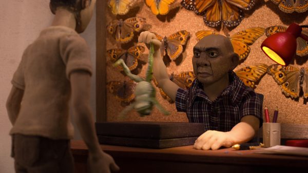 The Great Disgust film image; claymation man holding a frog by its foot