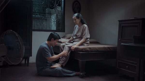 Hearing film image; man massaging a woman's leg