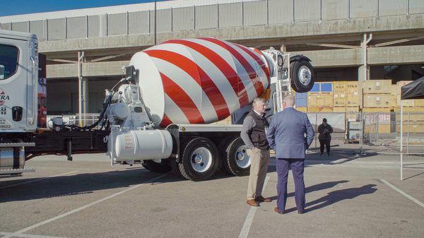 The History of Concrete film image; cement truck blocking a road