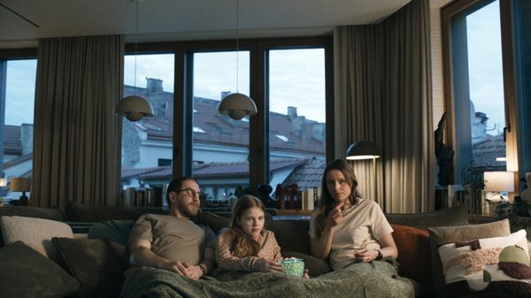 How To Divorce During The War film image; family sitting on couch