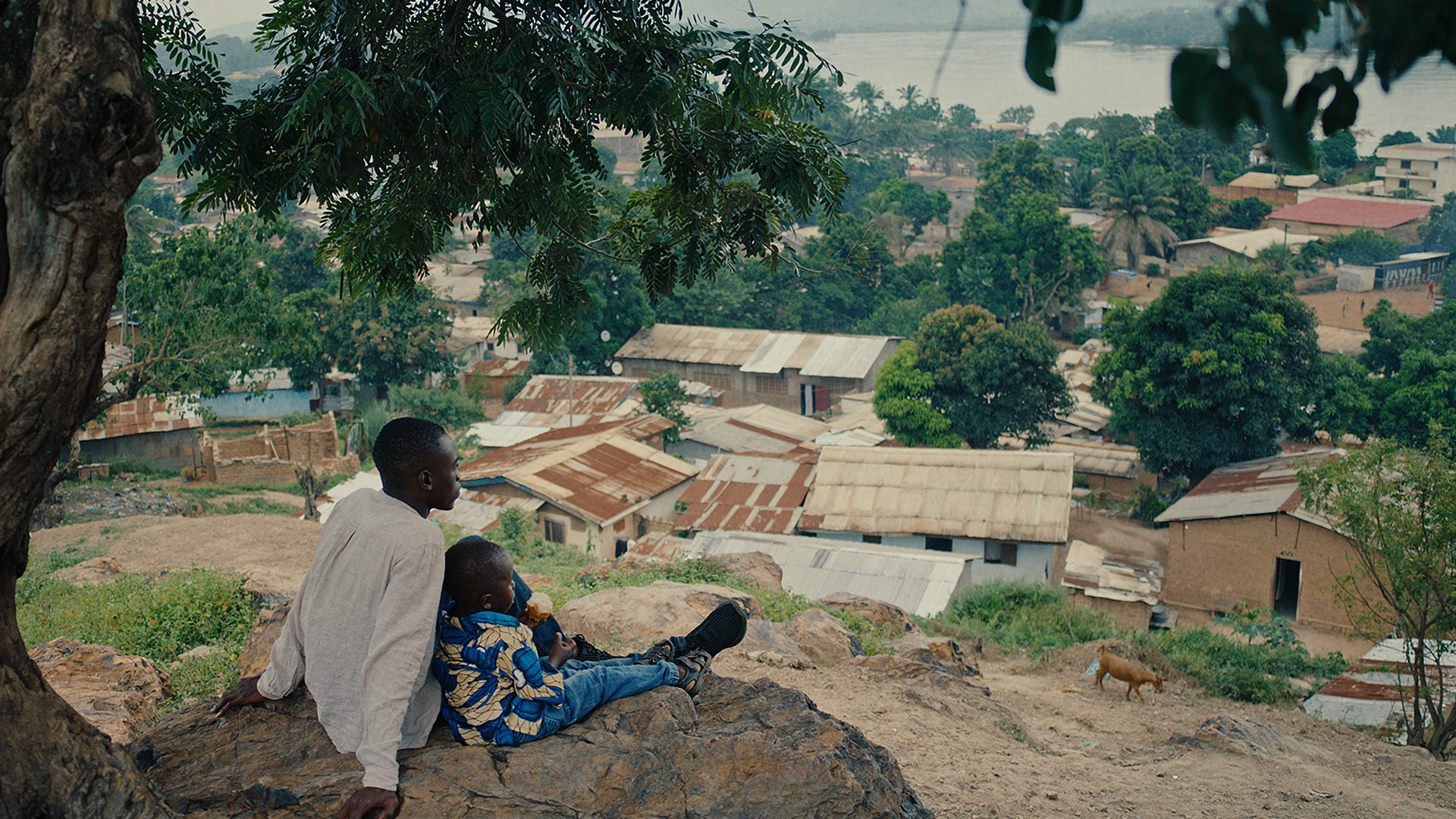 Congo Boy film image; two boys on a hill overlooking a village