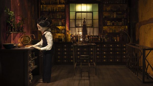 Invisible Harvests film image; person in an apothecary