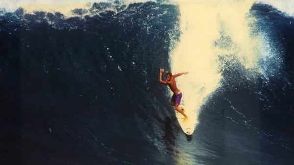 Jack Johnson: Surfilmusic film image; surfer cresting a huge wave