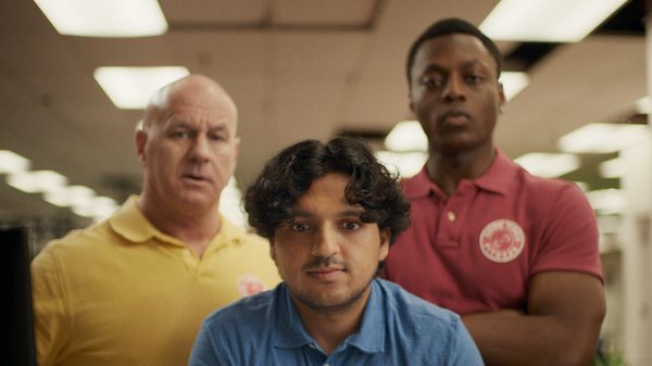 The Lion Does Not Concern Himself film image; three people staring at something
