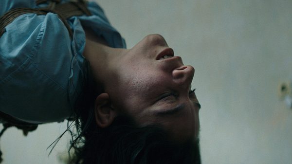 Lust film image; woman bent backwards