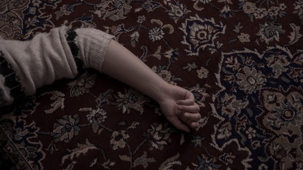 Memories of a Window film image; an arm splayed out on a carpet