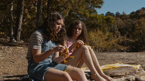 Mouse film image; two people sitting on a beach