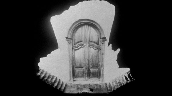 Object of Riddle film image; a door with two staircases leading away from it