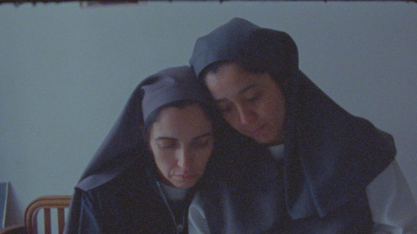 Oh Be a Fine Girl Kiss Me film image; two women consoling one another