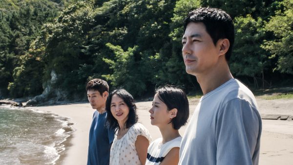 Possible Love film image; four people standing in a road looking at something