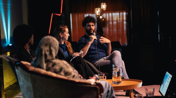 people chatting on couches