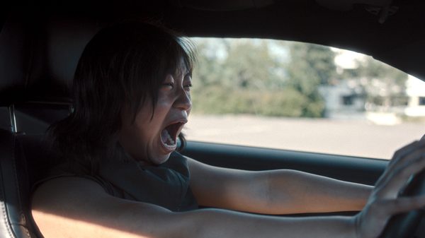 Prosecution film image; woman screaming in a car
