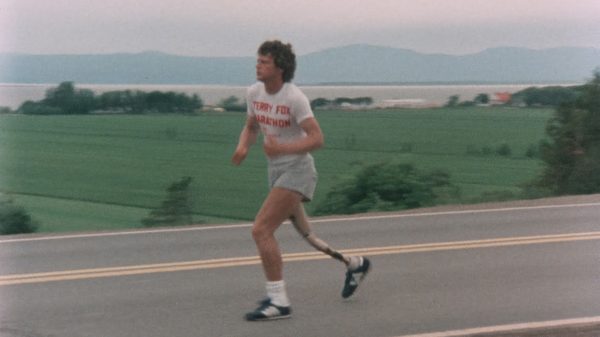 Run Terry Run film image; man with a prosthetic leg running on a street