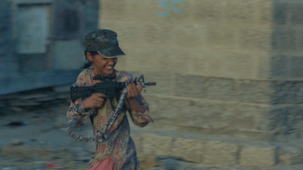 Saint & the Sea film image; child pointing a gun