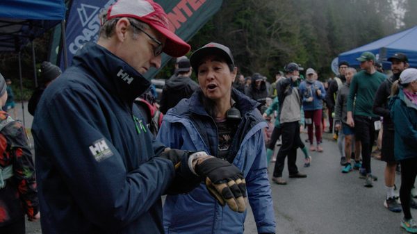 The Second Ascent film image; people gathered around for a race