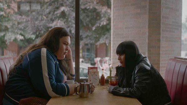 Seventeen film image; two people sitting in a diner booth