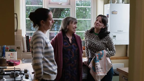 Tender Loving Care film image; three women chatting by a window