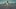The Tree of Life film image; woman walking across sand towards a sunset