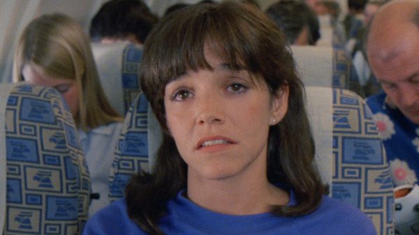 Vengeance Is Mine film image; woman sitting on a plane