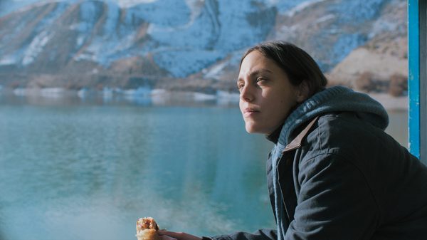 What Remains film image; woman looking out at the water