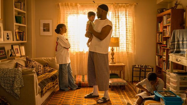 Your Mother Your Mother Your Mother film image; man holding a baby