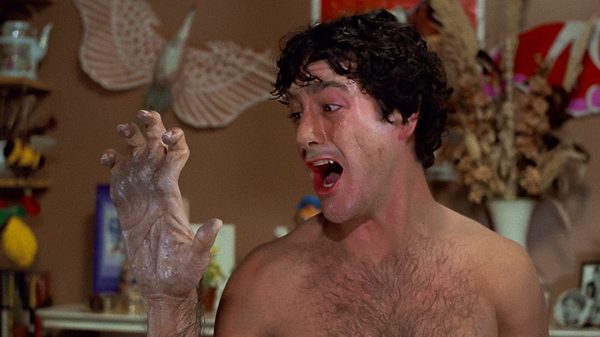 An American Werewolf in London film image; man freaking out over his hand stretching