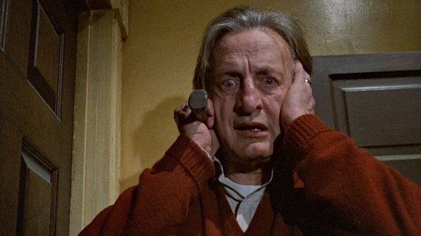 The Changeling film image; man clasping his hands to his face in horror