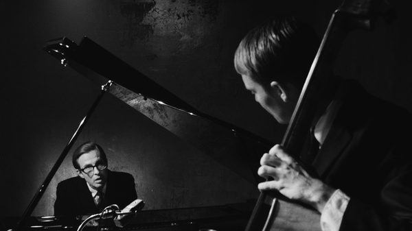 Everybody Digs Bill Evans film image; two men playing instruments