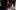 The Exorcist film image; possessed girl screaming at a man