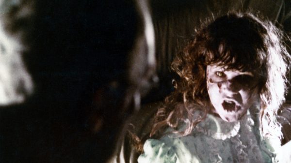 The Exorcist film image; possessed girl screaming at a man