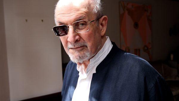 Knife: The Attempted Murder of Salman Rushdie film image; man wearing sunglasses with only one lens in them