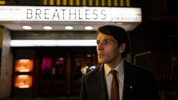 Once Upon a Time in a Cinema film image; man standing outside a movie theatre