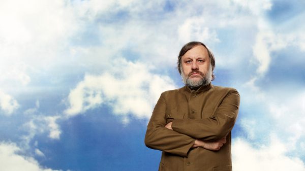 The Pervert's Guide to Ideology film image; man with his arms crossed and clouds behind him