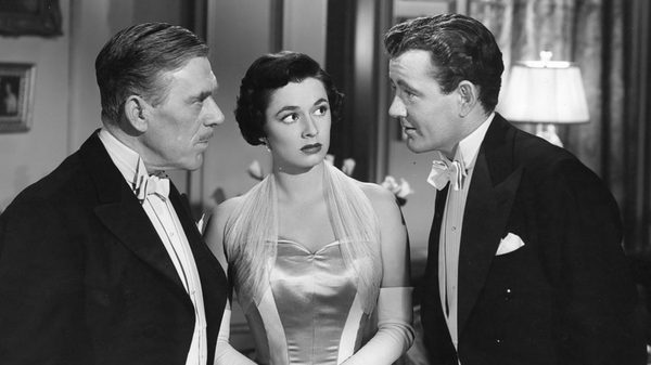 Strangers on a Train film image; three people in discussion
