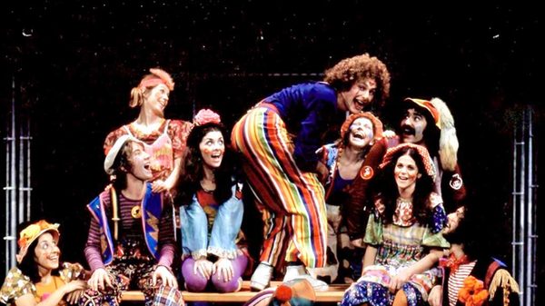 You Had to Be There film image; people in bright costumes performing on a stage