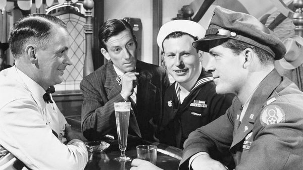 The Best Years of Our Lives film image; men gathered around a beer