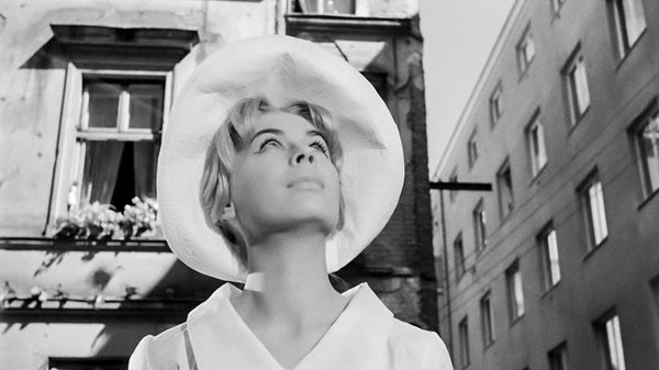 Innocent Sorcerers film image; woman looking up at something outside