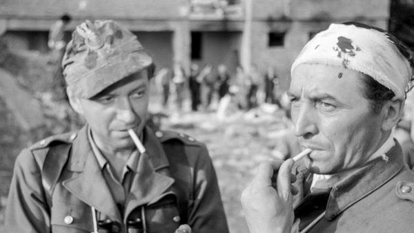 Kanal film image; two men smoking cigarettes