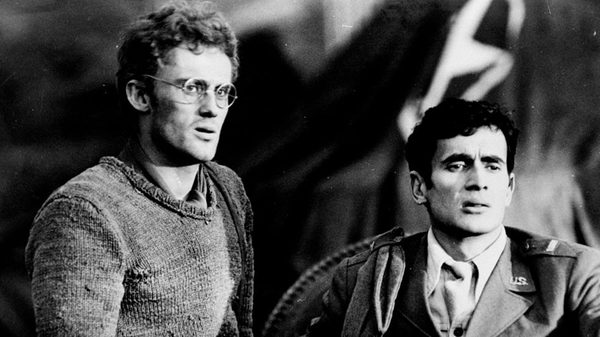 Landscape After The Battle film image; two men looking in shock at something offscreen