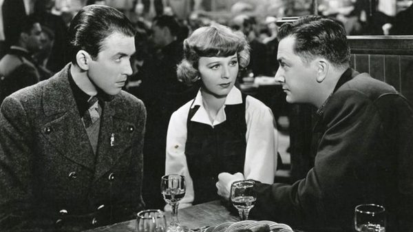 The Mortal Storm film image; three people sitting at a table over drinks