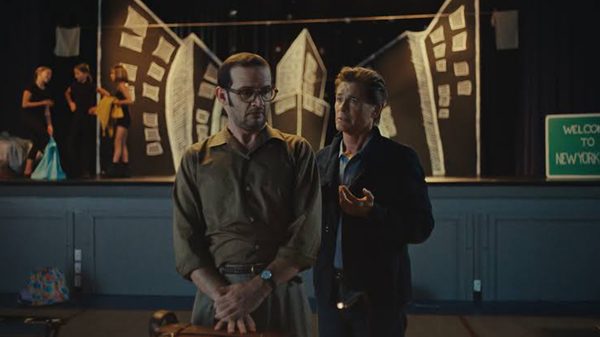 The Musical, film image; man talking at another man