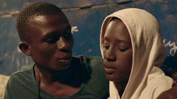 Xalé film image; man comforting a woman